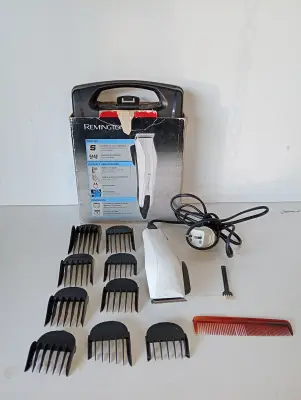 Maquina De Cortar Cabello Marca Remington Modelo Hc-5120 Usado En Buen Estado Acc: Con 9 Perfilñadores Con Peine Con Cepilliro Con Estuche En Caja