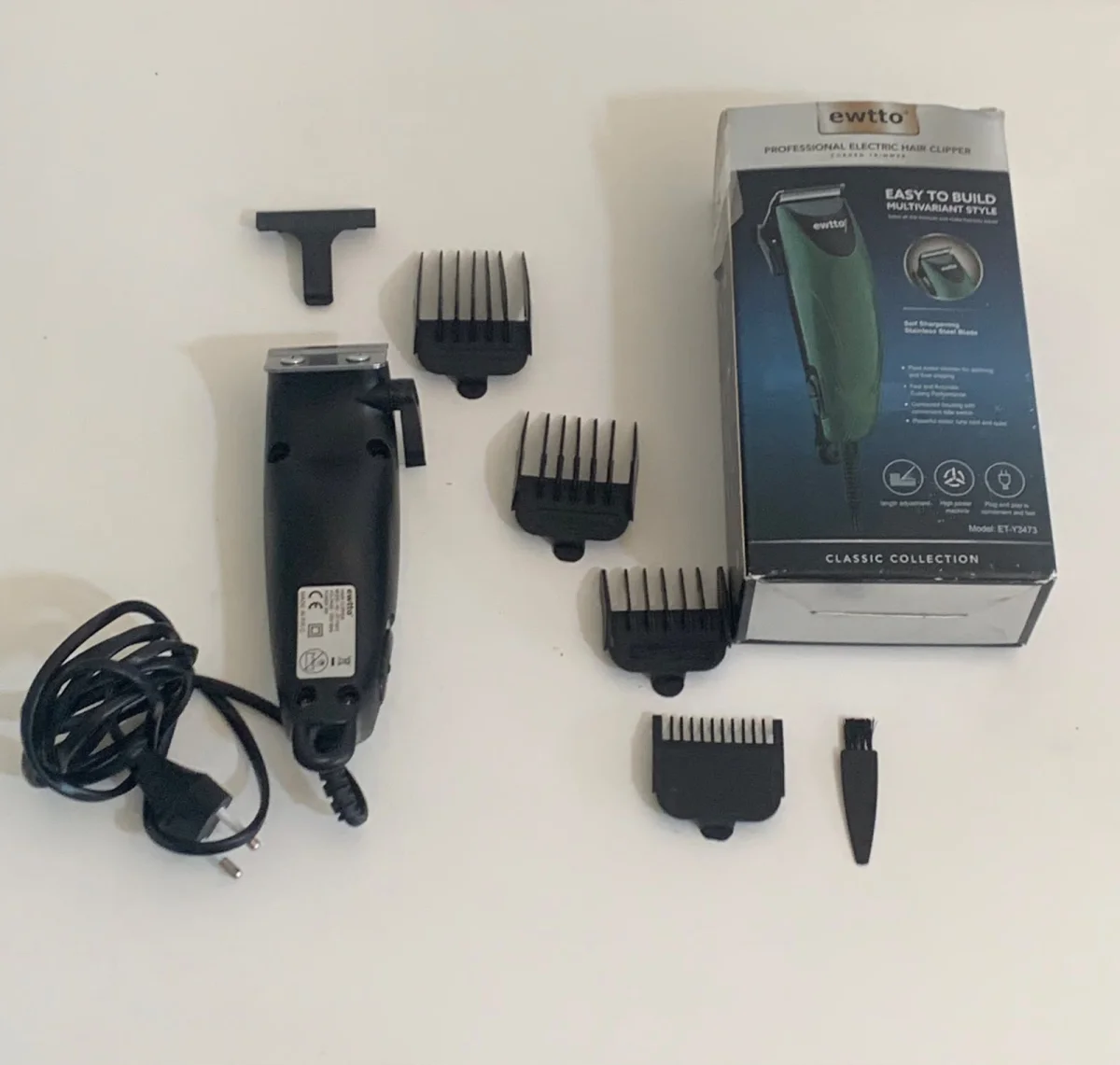 Foto 2 de Maquina De Cortar Cabello Marca Ewwto Modelo Et-Y3473 Usado En Buen Estado Acc Un Peine Nro 4 Un Peine Nro 3 Un Peine Nro 2 ProtectorUn Peine Nro 5 Un Cepillo